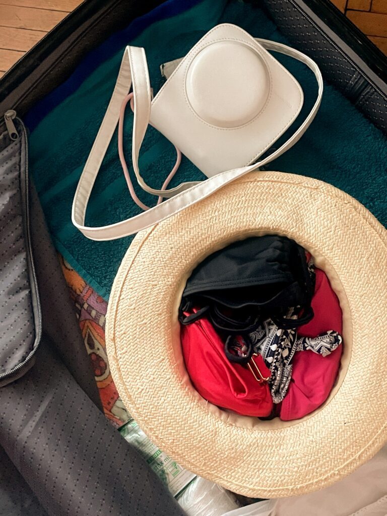 how to pack a hat in a suitcase